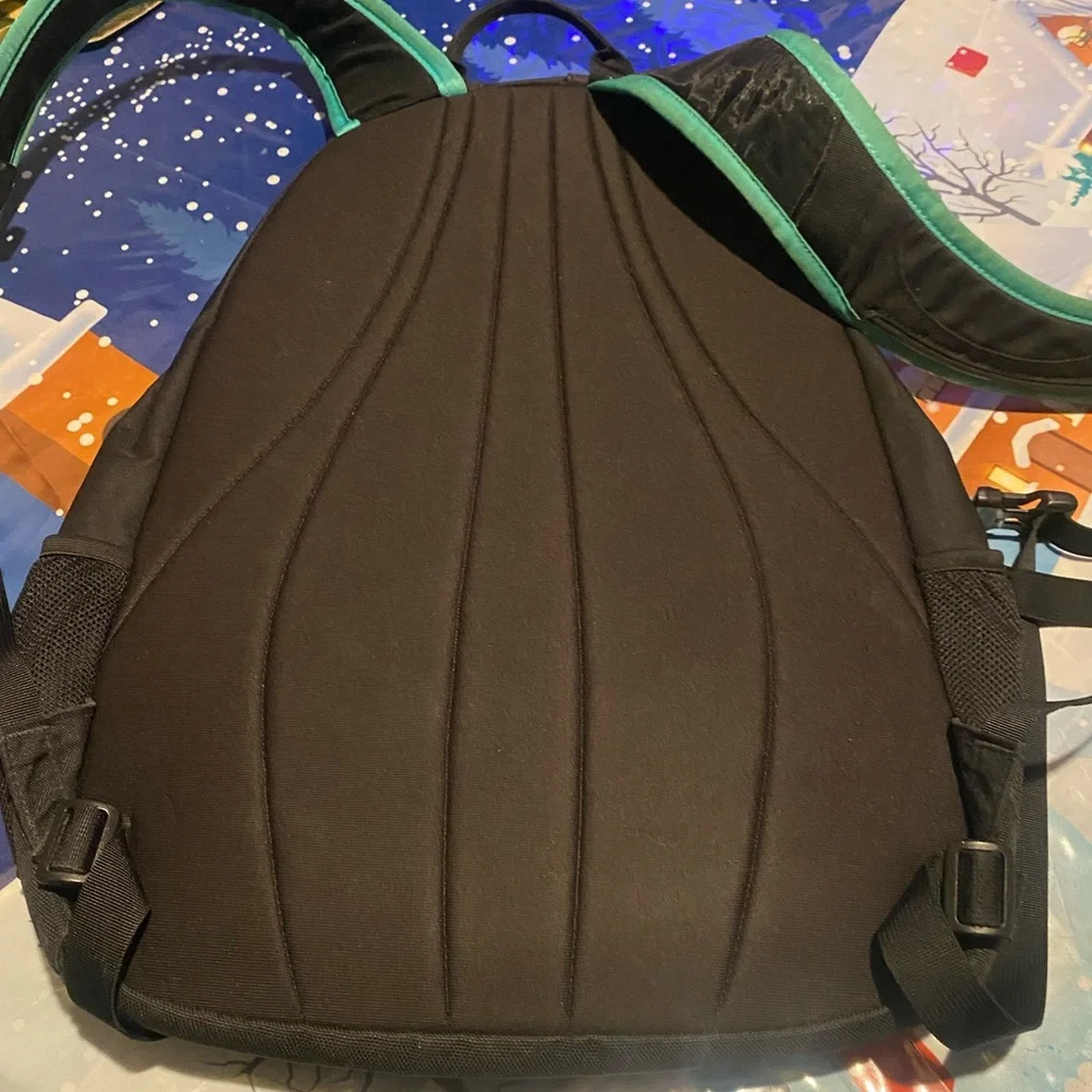The North Face Jester Black Backpack with Teal Straps